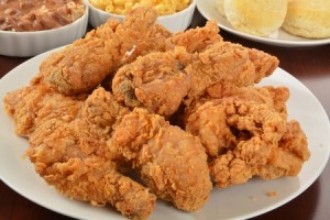 35844611 - a plate of fried chicken with side dishes